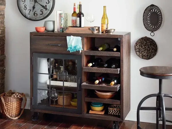 Wooden bar cabinet with wine and glassware.