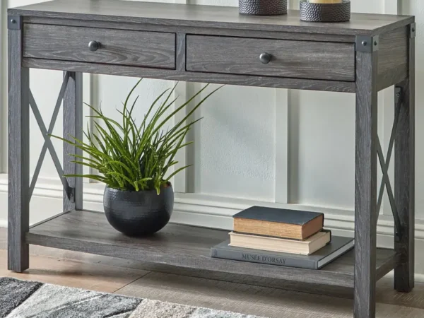 Gray console table with plants and books