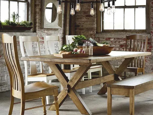 Rustic dining room with wooden table and chairs.