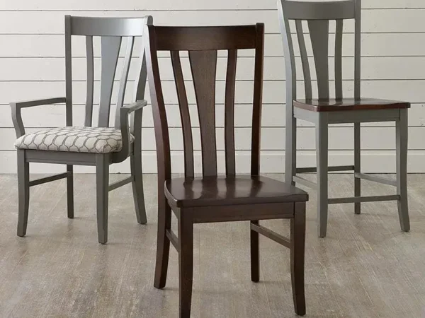 Three wooden chairs with slatted backs