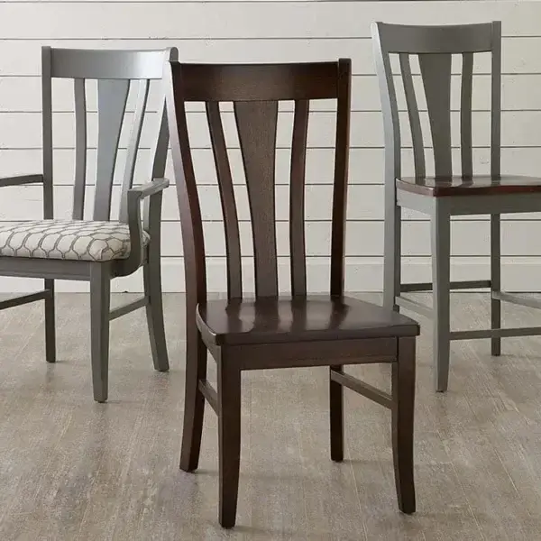 Three wooden chairs with slatted backs