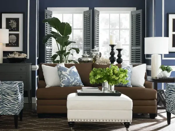 Stylish living room with blue walls and brown sofa.