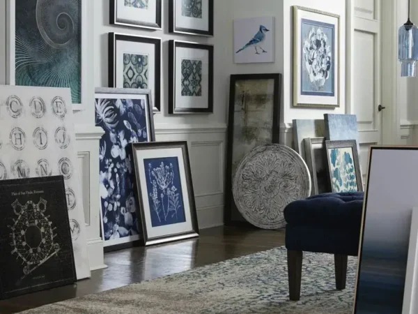 Various framed artwork displayed in a stylish room.