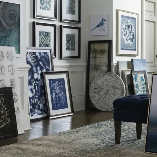 Various framed artwork displayed in a stylish room.