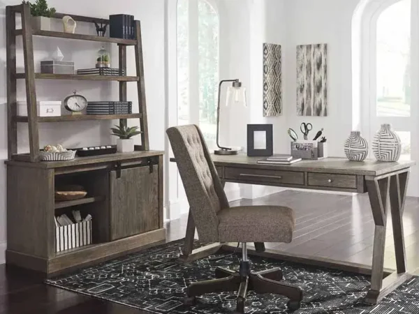 Modern home office with desk and bookshelf.
