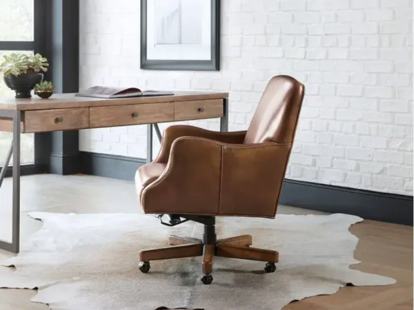 Modern office desk with brown leather chair