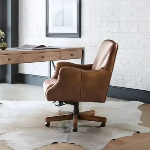 Modern office desk with brown leather chair