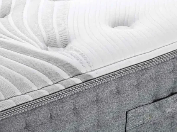 Close-up of textured white mattress surface