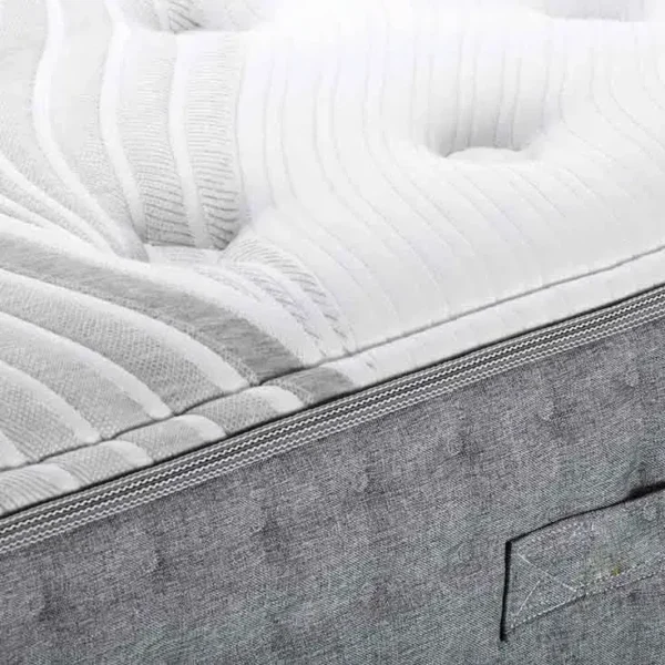 Close-up of textured white mattress surface