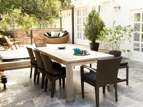 Modern patio dining set on stone tiles