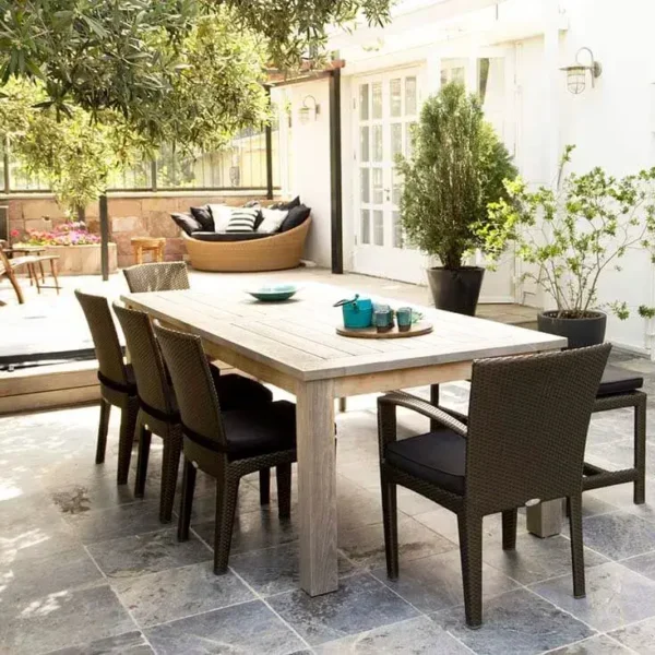 Modern patio dining set on stone tiles