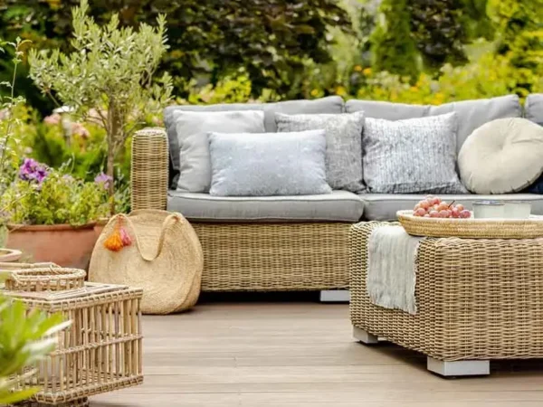 Outdoor patio with wicker furniture and decor.
