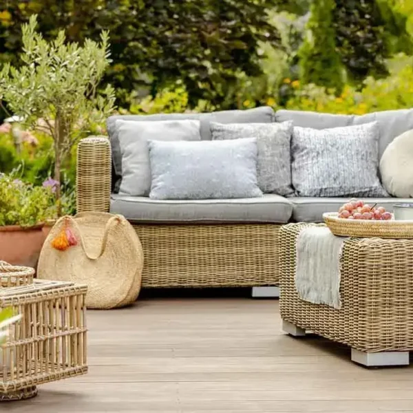 Outdoor patio with wicker furniture and decor.