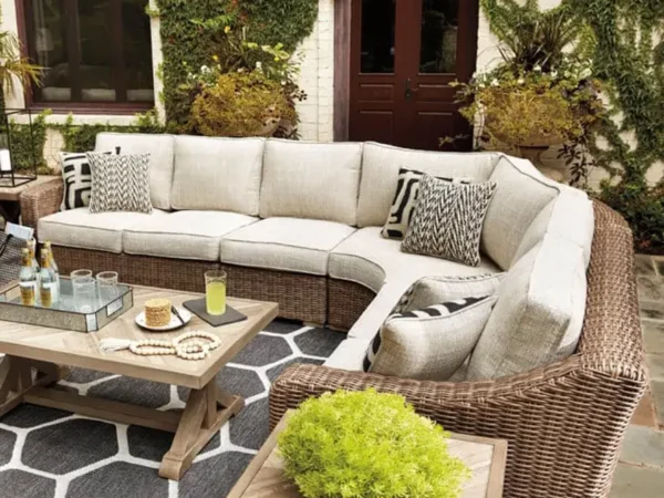 Outdoor patio with wicker sectional and coffee table