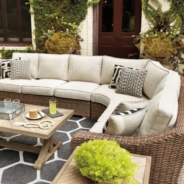 Outdoor patio with wicker sectional and coffee table