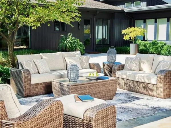 Cozy outdoor patio with wicker furniture.