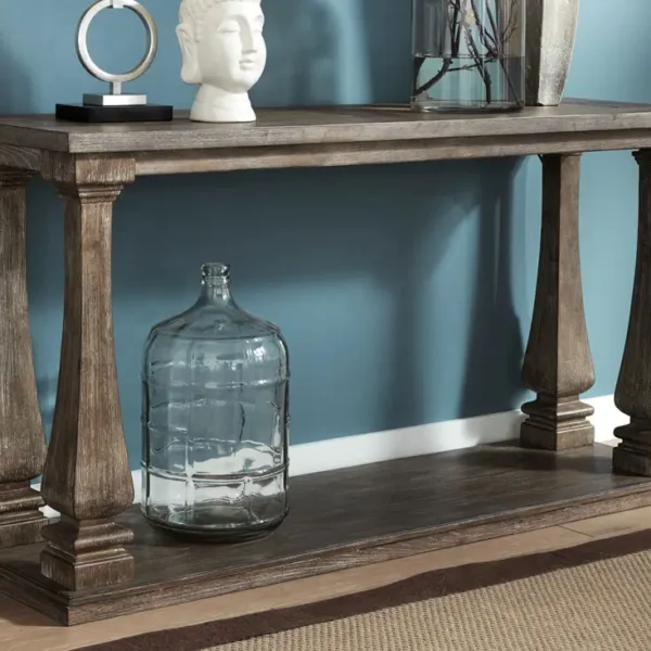 Wood console table with decorative objects and vase.