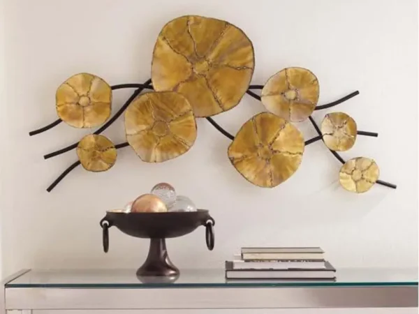 Yellow wall art with decorative bowl on table