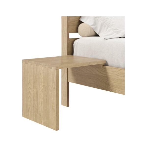 Light oak wood floating nightstand attached to a bed rail.