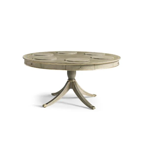 Round gray pedestal table with gold trim and integrated placemats.