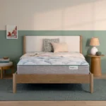 BeautySleep mattress on a wooden bed frame in a bedroom.