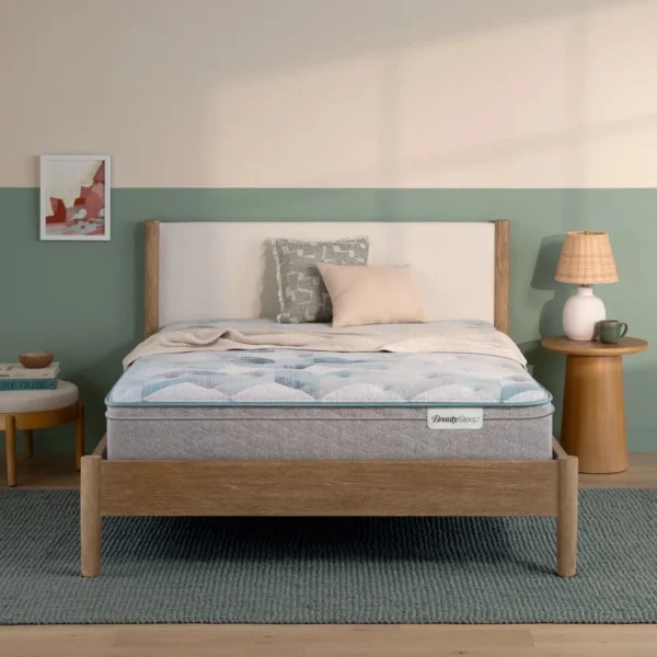 BeautySleep mattress on a wooden bed frame in a bedroom.