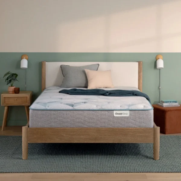 A BeautySleep mattress on a modern wooden bed frame.