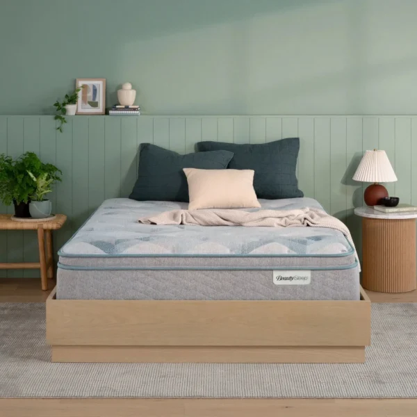BeautySleep mattress on a wooden bed frame in a bedroom.