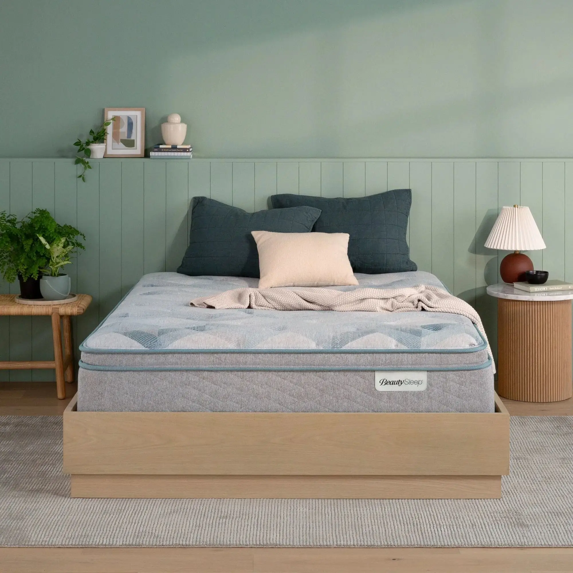 beautysleep dream weaver firm tight top mattress 11.5" (copy) BeautySleep mattress on a wooden bed frame in a bedroom.