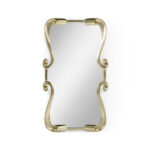 Ornate gold scrollwork wall mirror on white background