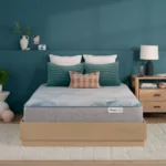 BeautySleep mattress on a wooden platform bed in a bedroom.