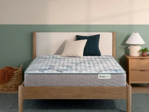 BeautySleep mattress on a modern wooden bed frame.
