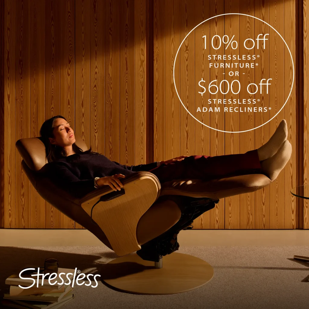 Woman relaxing in a recliner against a wood-paneled wall.