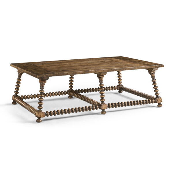 Rustic wood coffee table with bobbin-turned legs and stretchers.