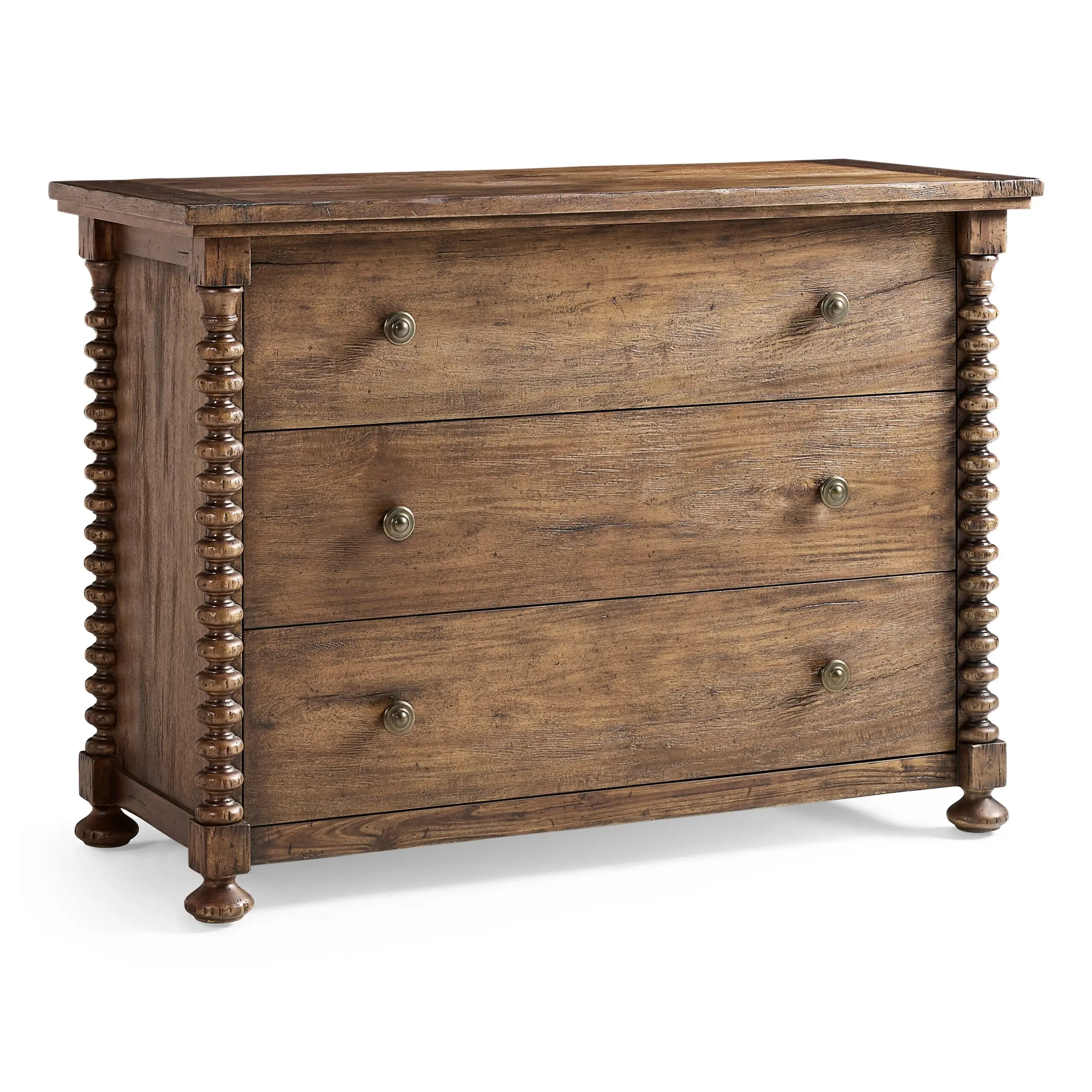 tamarisk three drawer chest Rustic three-drawer wooden dresser with turned spool detailing.