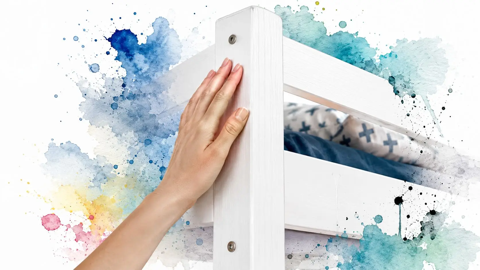 A close-up view of a person's hand touching the white wooden frame of a bunk bed.