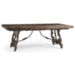 Rustic dark wood dining table with ornate carved legs