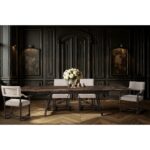 Formal dining room with dark paneled walls and wooden table.