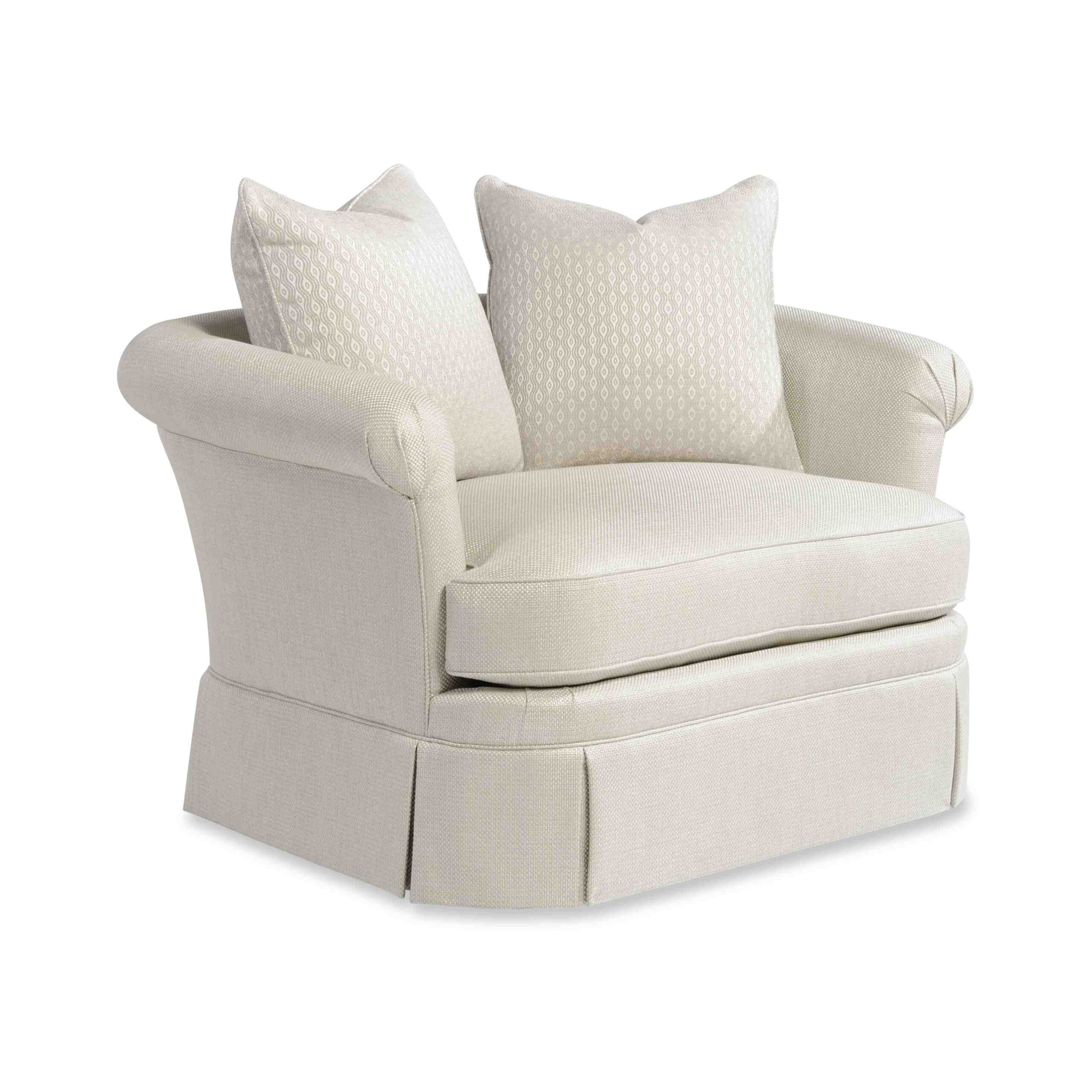 adriana swivel chair and a half A beige rolled-arm accent chair with patterned throw pillows.