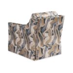 Upholstered armchair with a blue and gold marble pattern.