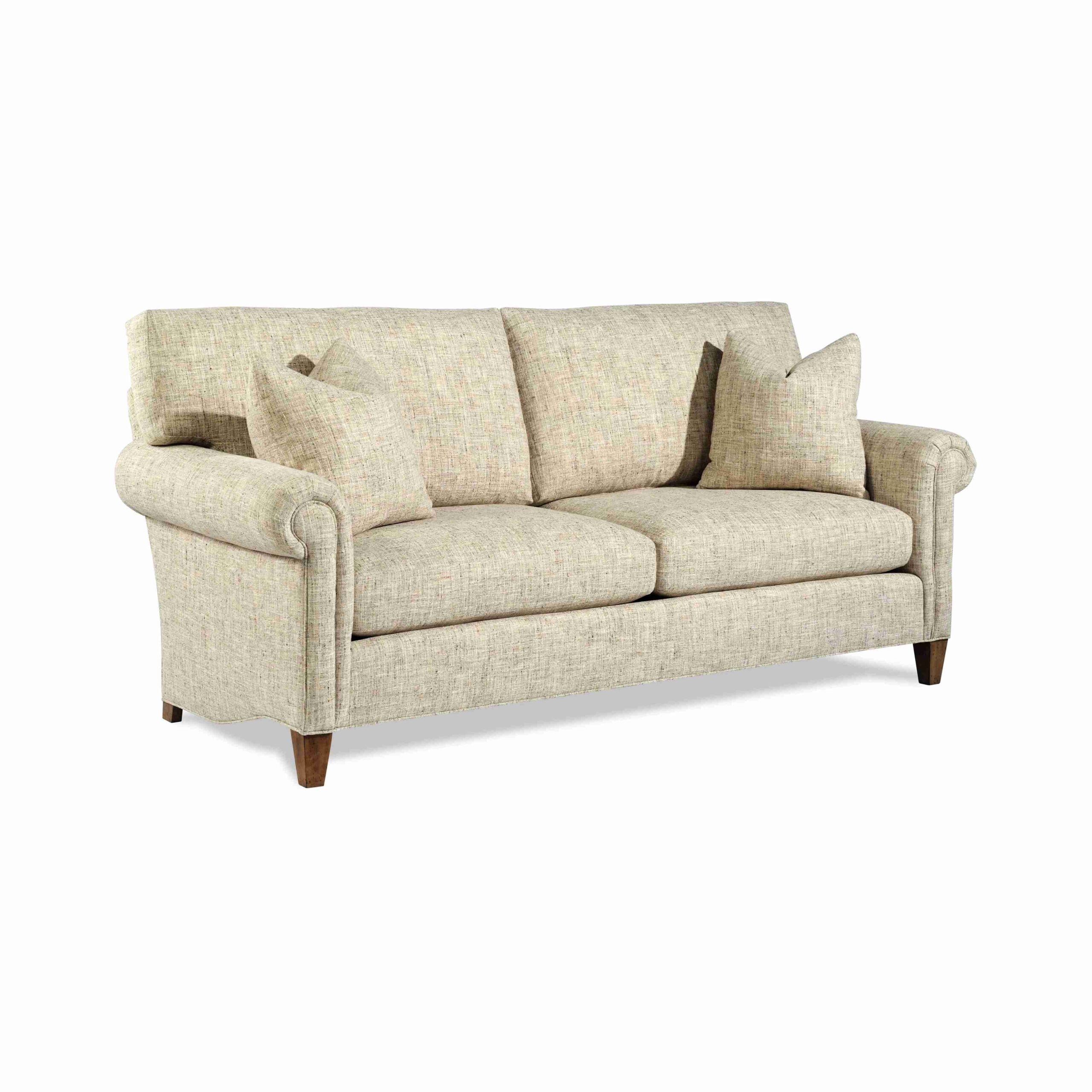 cozy creations "bitsy" sofa Beige upholstered sofa with rolled arms and accent pillows.