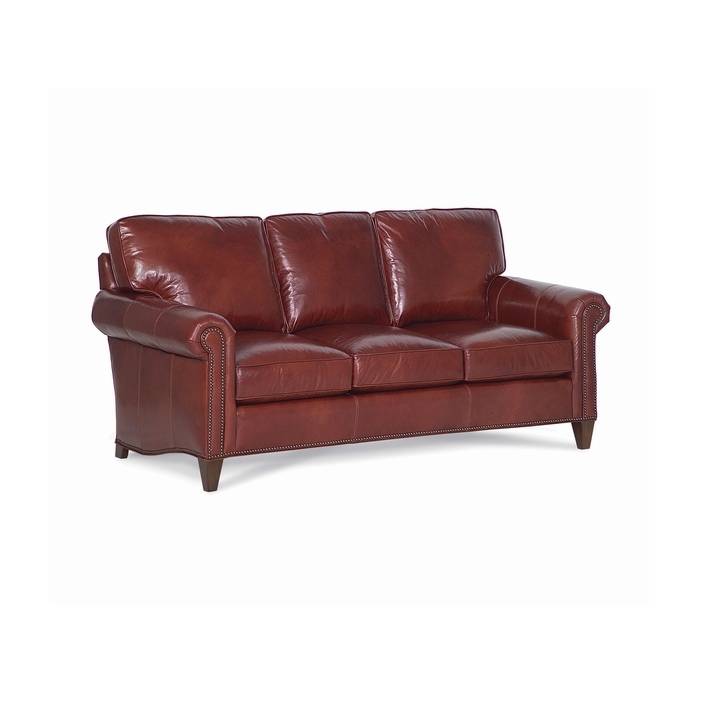 cozy creations leather sofa Classic three-cushion reddish-brown leather sofa with nailhead trim.