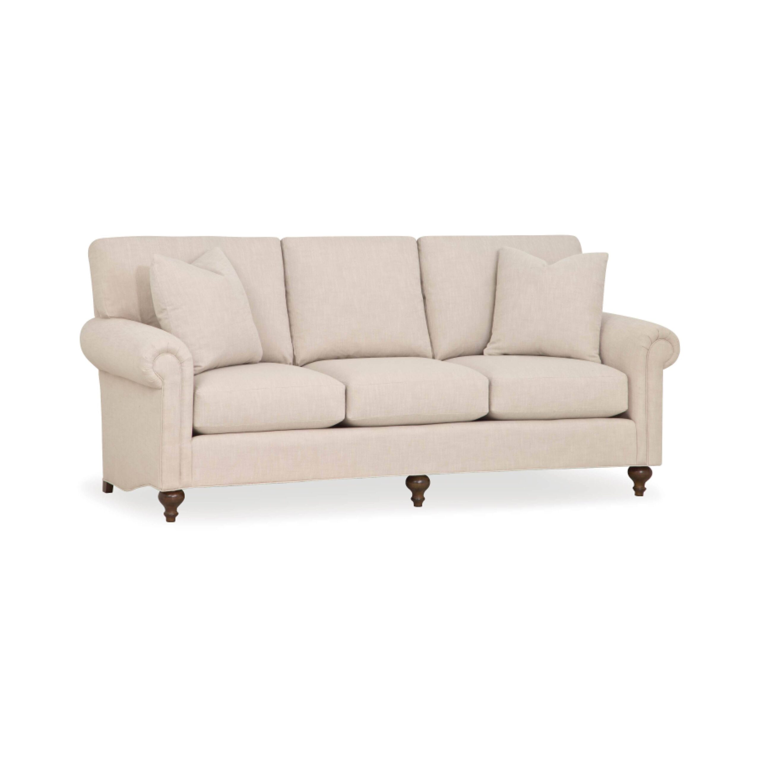 cozy creations sofa Beige three-seater sofa with rolled arms and bun feet.