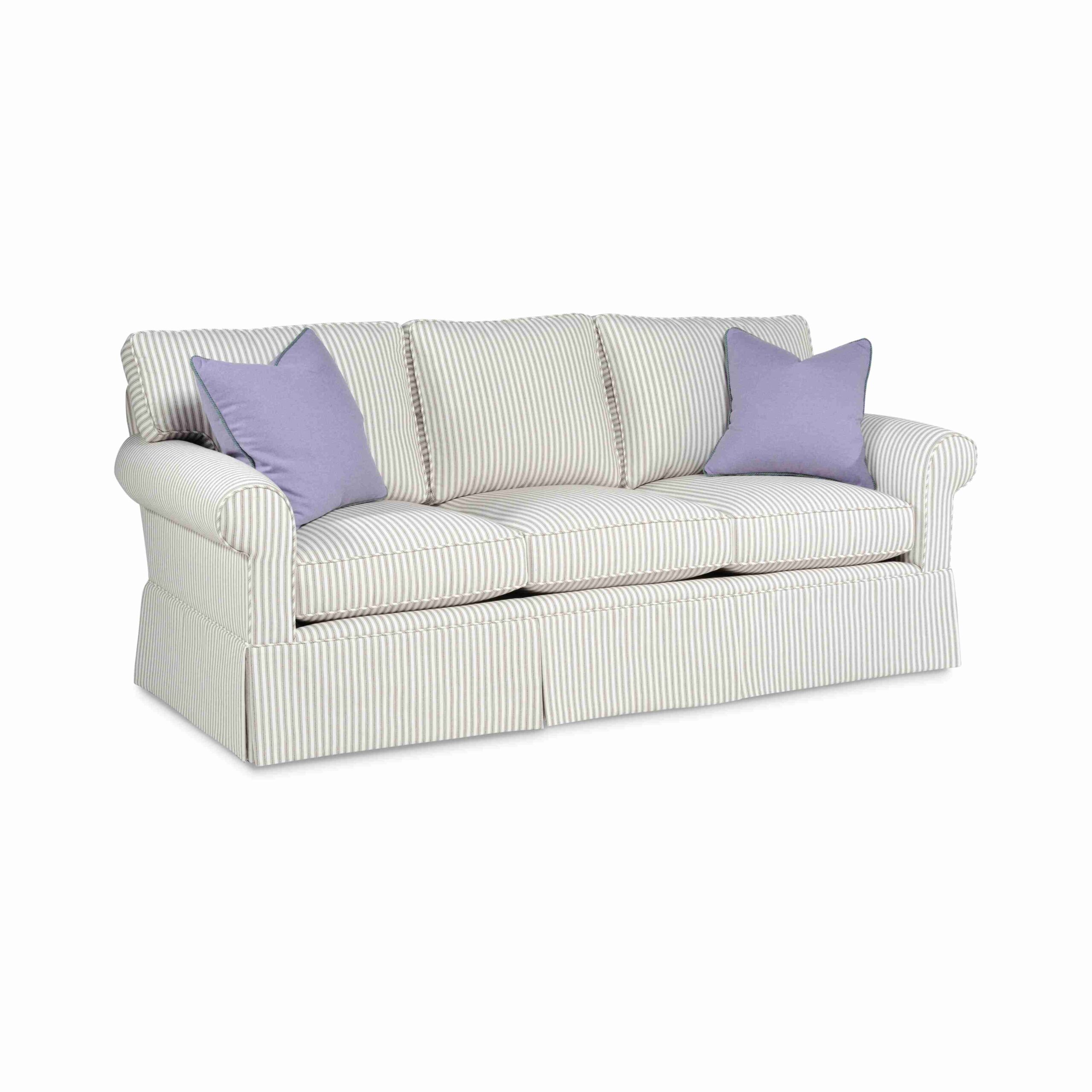 cozy creations sofa Striped three-seater sofa with two purple throw pillows.