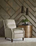 Cream leather recliner chair in a modern interior setting.