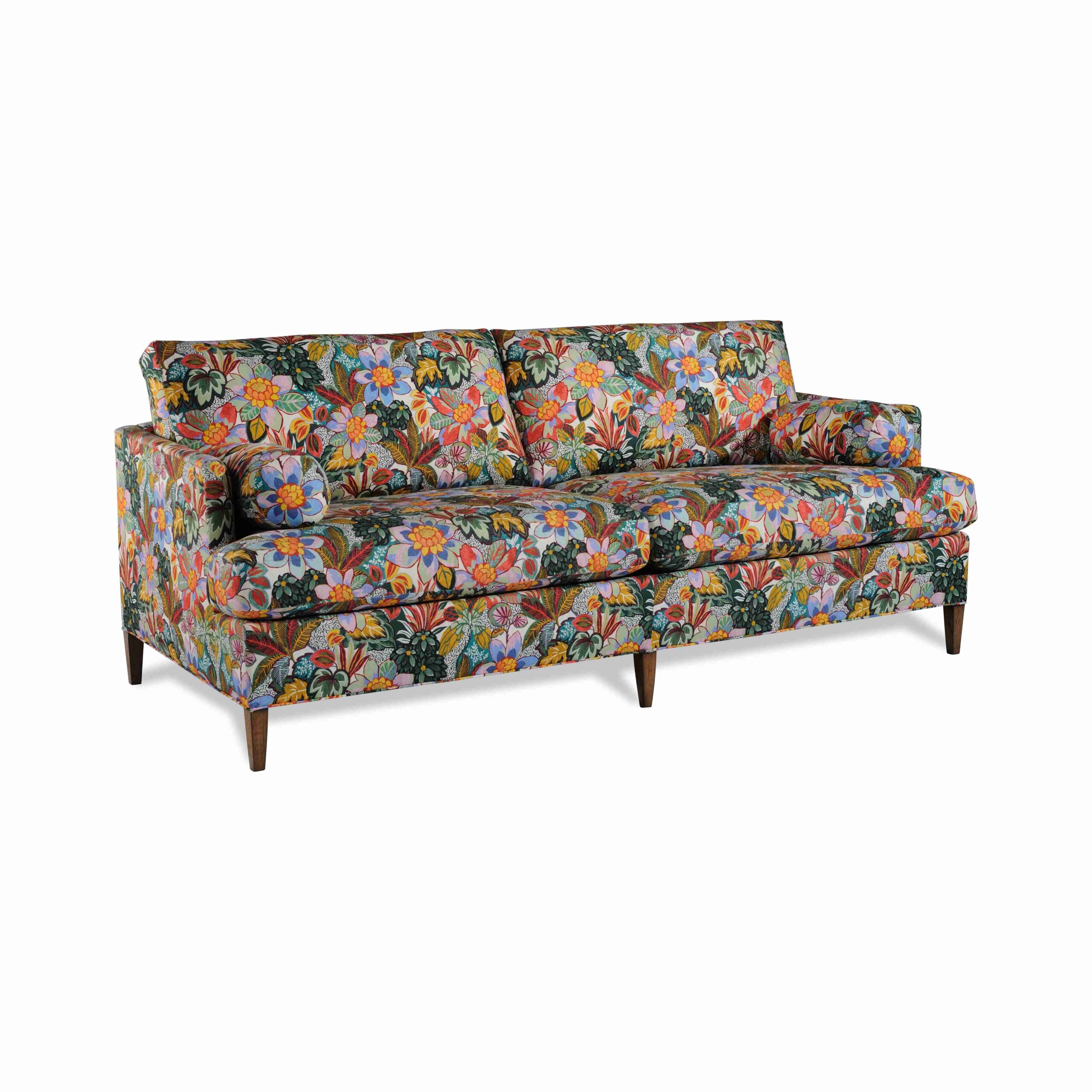 isabel sofa Vibrant floral patterned sofa with tapered wooden legs.