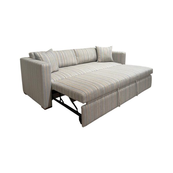 Striped pull-out sleeper sofa bed with matching pillows.