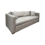 Modern striped track arm sofa on a white background.