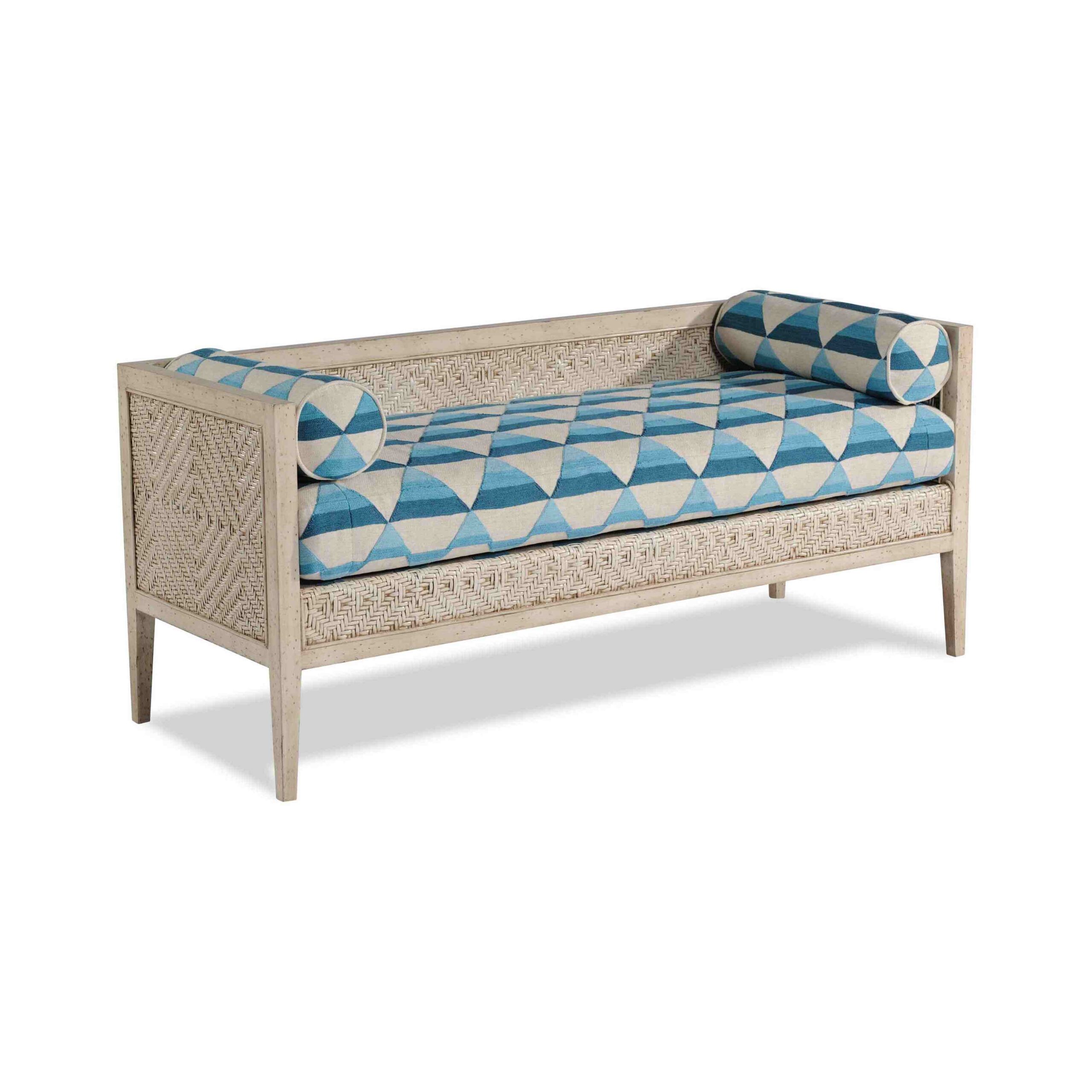 noble settee White woven daybed with blue geometric pattern cushion and bolsters.