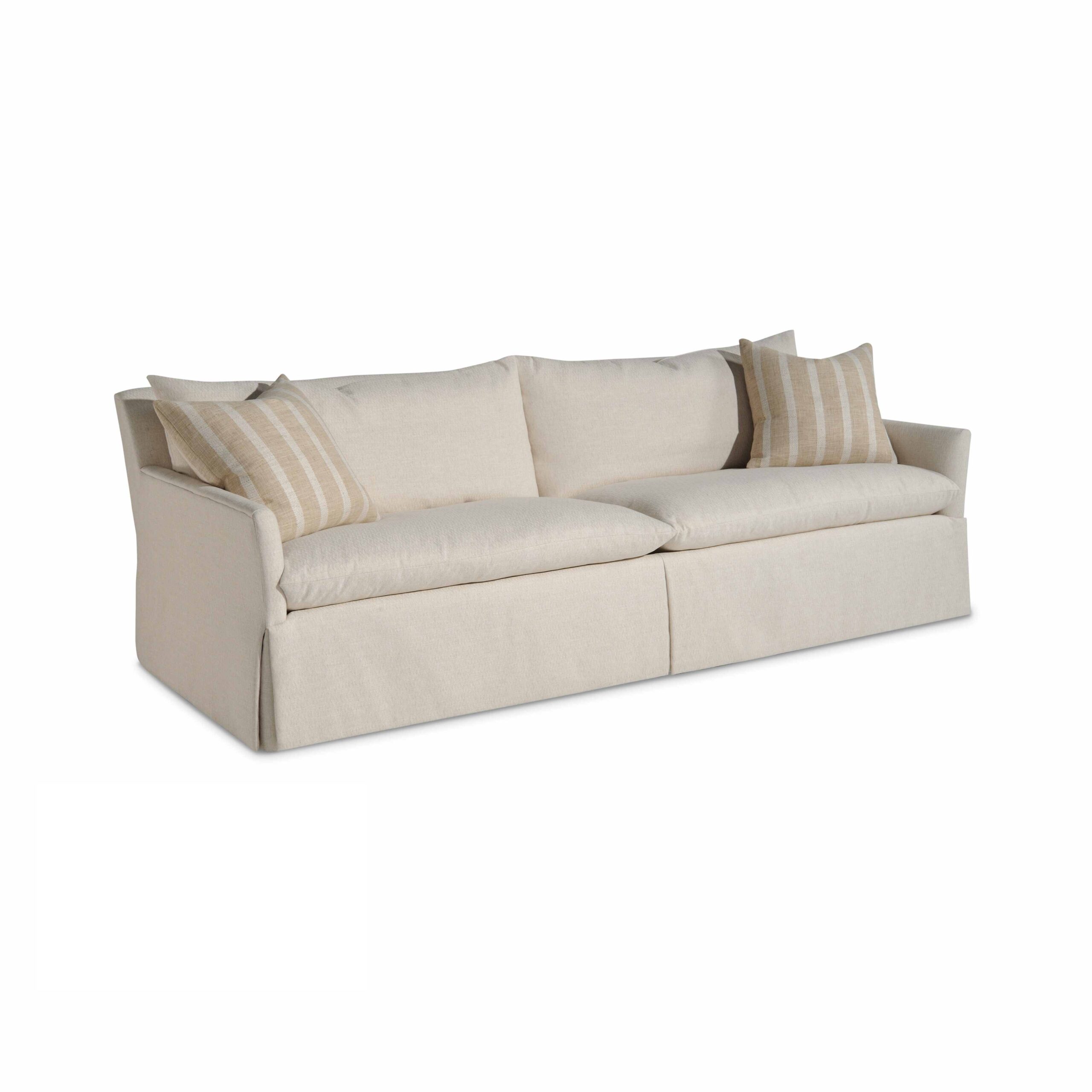 resolution sofa w/waterfall skirt Off-white slipcovered sofa with striped throw pillows.